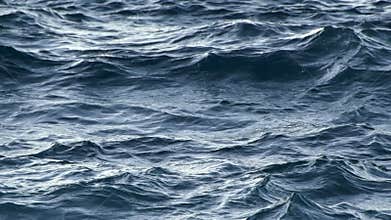 Sea waving during light storm. Day light