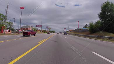 FPV Driving on a busy road restaurants Gas stations urban scene
