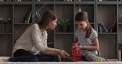 Family play together creative magnetic constructor at home