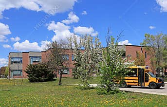 School building with school bus
