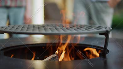 Closeup fire flame on backyard. Bonfire making for preparing food outside
