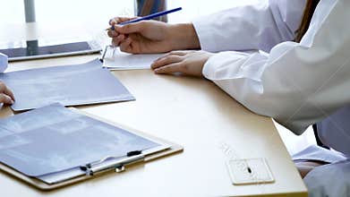 Doctor writing prescription for medical health care oncologist therapy using laptop. Two women doctors consultation with professio