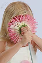 Girl hiding behind flower