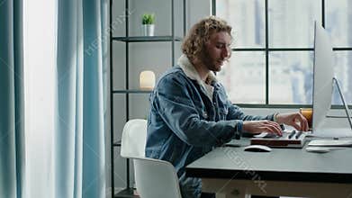 Blond man in denim fur collar jacket plays digital piano
