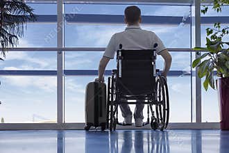 Young man in a wheelchair at the airport
