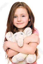 Smiling little girl with a teddy elephant