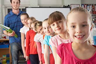 Teacher with line up of children in class