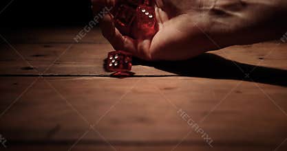 Dice roll. hand throwing game cubes. concept of risk and gamble