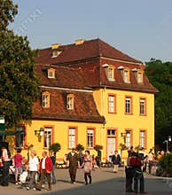 A young couple and other people strolling