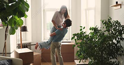 Happy millennial couple celebrate relocation day to own house