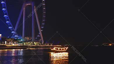 Dubai Marina Port, UAE. The traditional boat and luxury yacht ship club with skyline background. Located near business