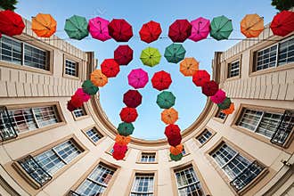 Multicolor umbrellas hanging on the air