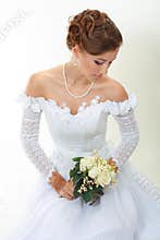 Beautiful young woman with bouquet