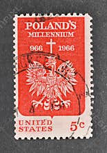 Cancelled postage stamp printed by USA, that shows Polish Eagle and Cross