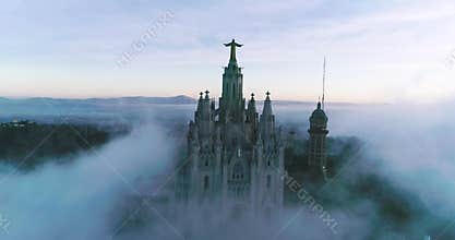 Temple in Tibidabo, Barcelona. Morning Aerial Sunrise Beautiful Foggy Scenary