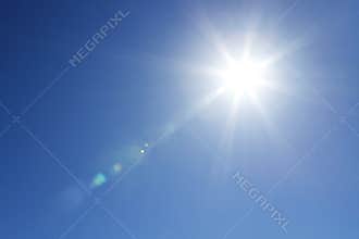 Shining sun at clear sky with copy space