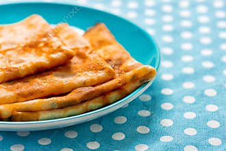 Bliny served on ceramic plate