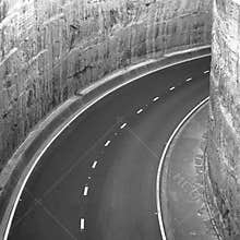 Cahill Expressway winding into tunnel cut through rocks