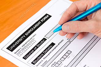 Hand Completing a University Application Form