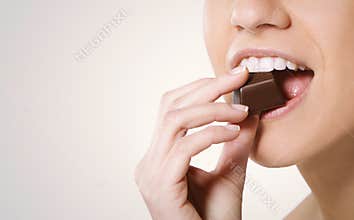 Woman eating chocolate