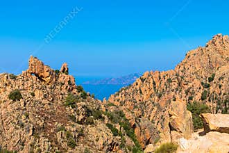 Bizarre red rocks in the Calanches above the gulf of Porto, Corsica France
