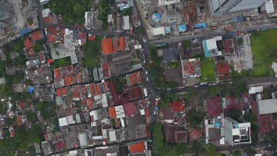 Aerial Birds Eye Overhead Top Down View of rooftops in urban residential neighborhood of Jakarta, Indonesia