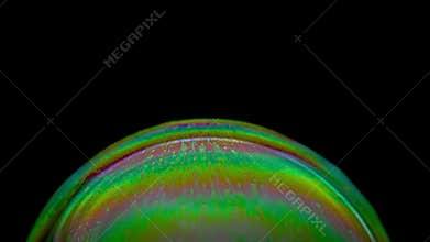 Close-up of the top of an emerald soap bubble