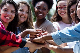 Group of international young adults stay together