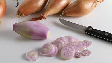 Whole Banana shallots, echalion, cut into rings close up