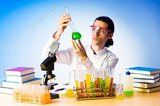 Chemist in the lab experimenting