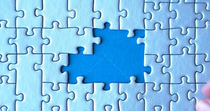 Grey puzzles isolated on grey background. Social issue concept