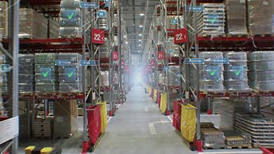 Concept of automation and digitalization of warehouse. A fly-through of product rows with infographics and digital