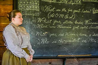 Teacher with Chalkboard, Cursive Handwriting