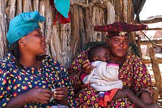 Twyfelfontein, Namibia - Jul 10, 2019: Herero Woman in traditional clothes in Twyfelfontein. Namibia