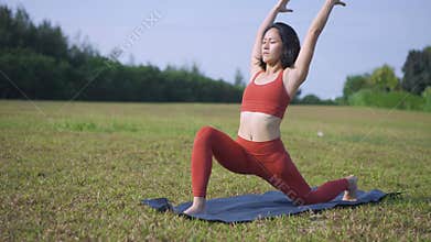 Slow motion Asian chinese female yoga yogi stretching in morning sun singapore
