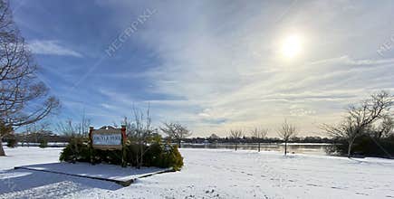 Argyle parks north side with snow on the ground and wispy clouds