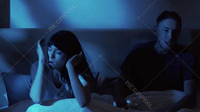 couple argument night conflict husband wife in bed