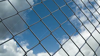 Chain link fence and skyline timelapse view from jail prison restricted area