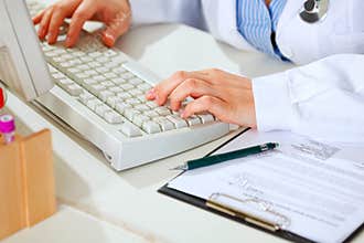 Close-up on hands of female medical doctor woman