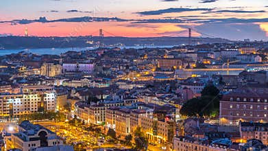 Lisbon after sunset aerial panorama view of city centre with red roofs at Autumn day to night , Portugal