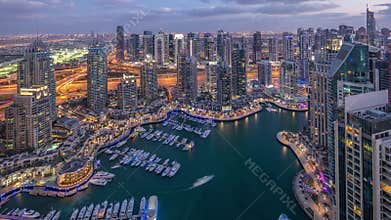 Dubai Marina skyscrapers and jumeirah lake towers view from the top aerial day to night timelapse in the United Arab