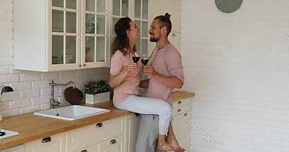 Passionate 30s family couple enjoying romantic home dating.