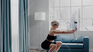 Lady in tracksuit does squats training with VR goggles