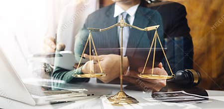 Business and lawyers discussing contract papers justice and law concept picture with film grain effect