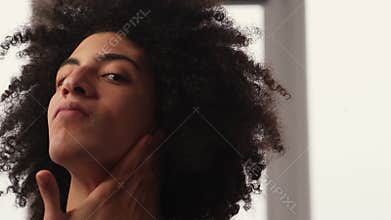 man facial care skin treatment applying face cream