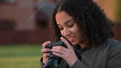 Beautiful African American mixed race biracial teenager young woman photographer