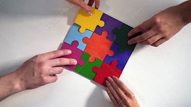 Teamwork of partners. Concept of integration and startup with puzzle pieces