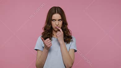 Girl bending fingers, counting and looks with contemplation.