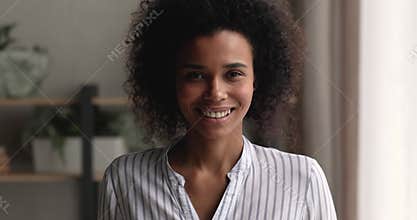 Head shot portrait smiling beautiful young african american woman.