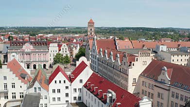 Forwards fly and tilt down reveal Neuer Markt square with colourful gabled houses and building of city hall